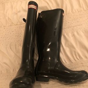Tall black hunter boots